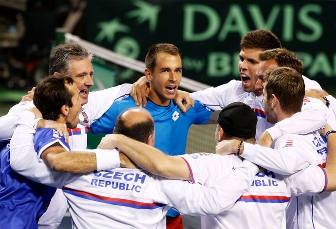 Rosol and Stepanek of the Czech Republic celebrate with their team mates after winning their Davis Cup quarter-final men's doubles tennis match against Japan's Ito and Uc