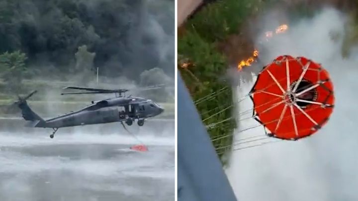 Polský Black Hawk pomáhá hasit požár u Hřenska. Pilot nalétává těsně k hladině Labe; Zdroj foto: Aktuálně.cz/Twitter/Lukáš Bíba, Aktuálně.cz/Twitter/Polska Policja