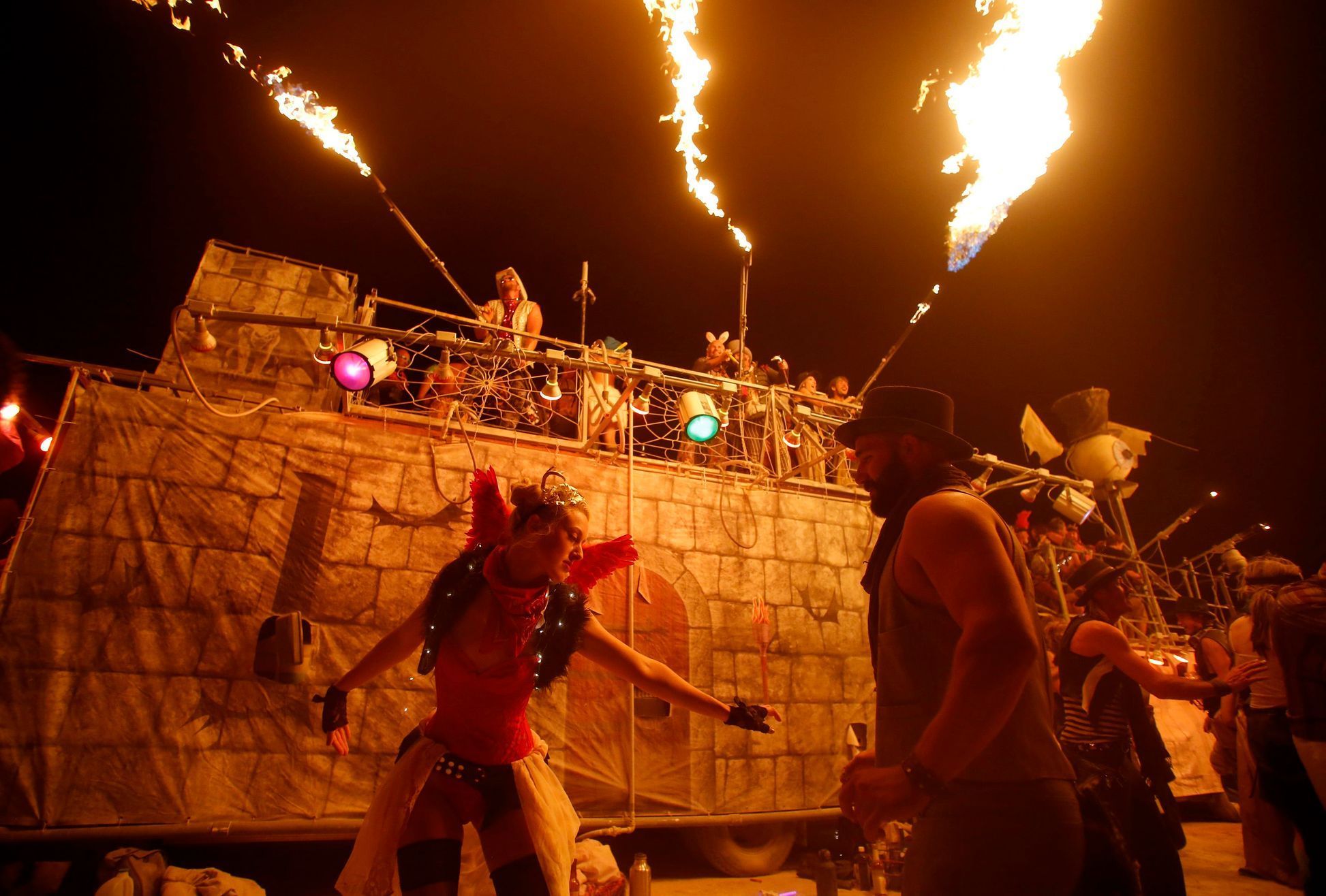 Rachael Neubauer and James Wheeler dance during the Burning Man 2014 &quot;Caravansary&quot; arts and music festival in the Black Rock Desert of Nevada