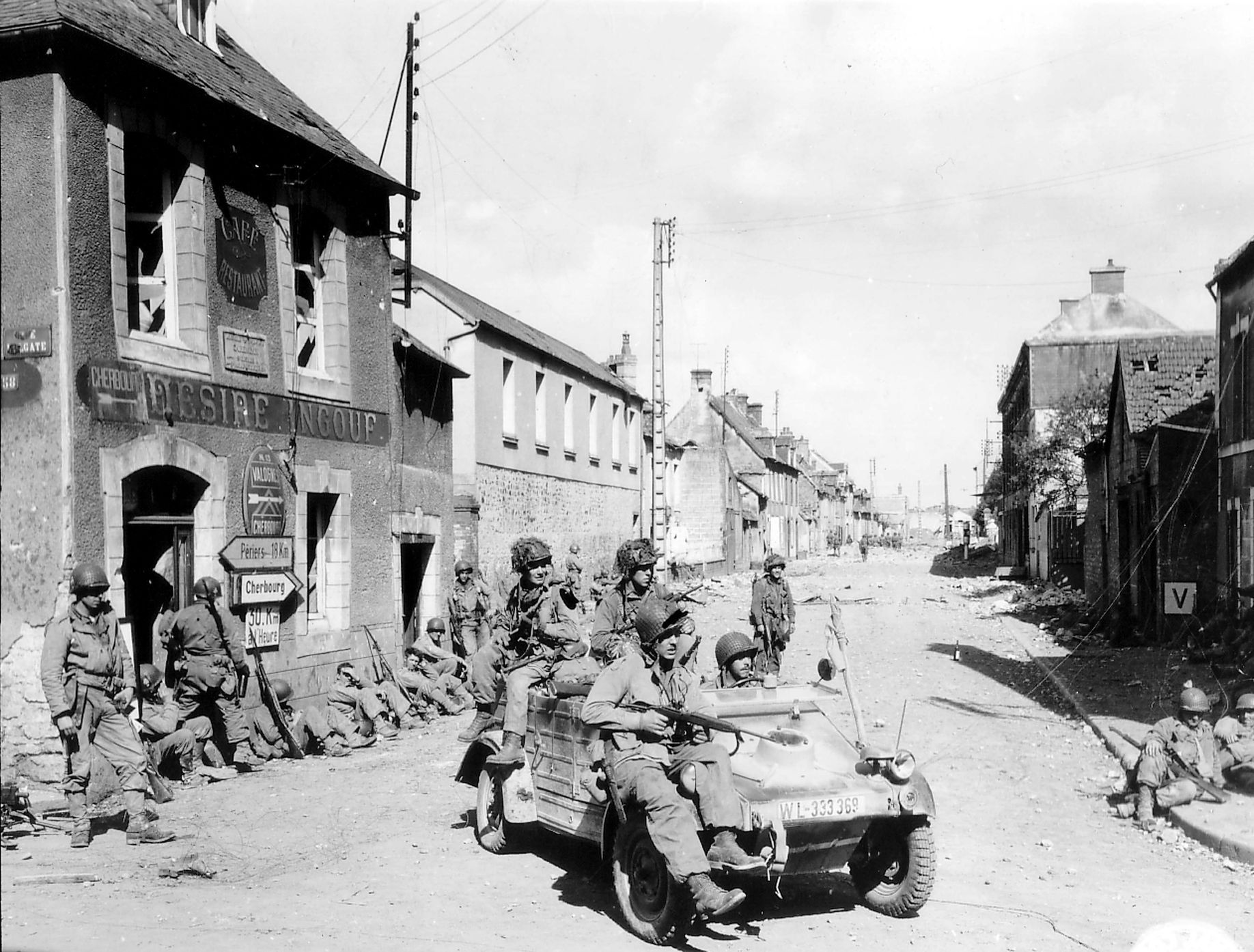 Handout photo of U.S. Army paratroopers of the 101st Airborne Division driving a captured German Kubelwagen on D-Day in Carentan