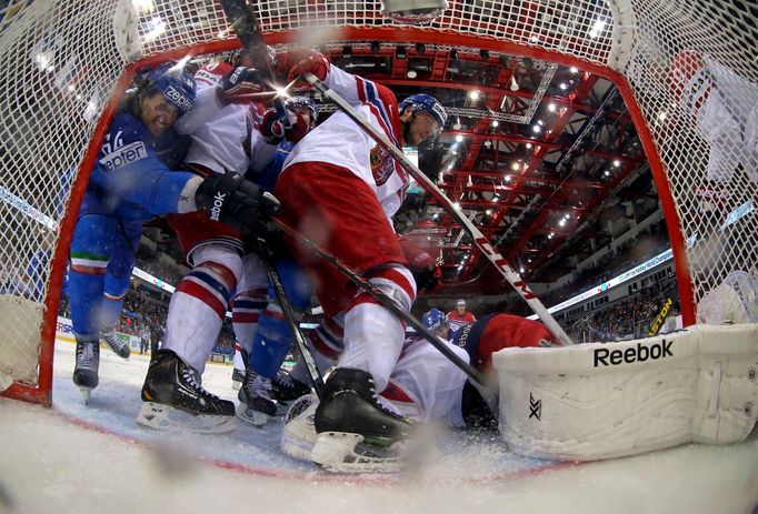 Goaltender Alexander Salak of the Czech Republic (R) saves during their men's ice hockey World Championship Group A game against Italy at Chizhovka Arena in Minsk May 14,