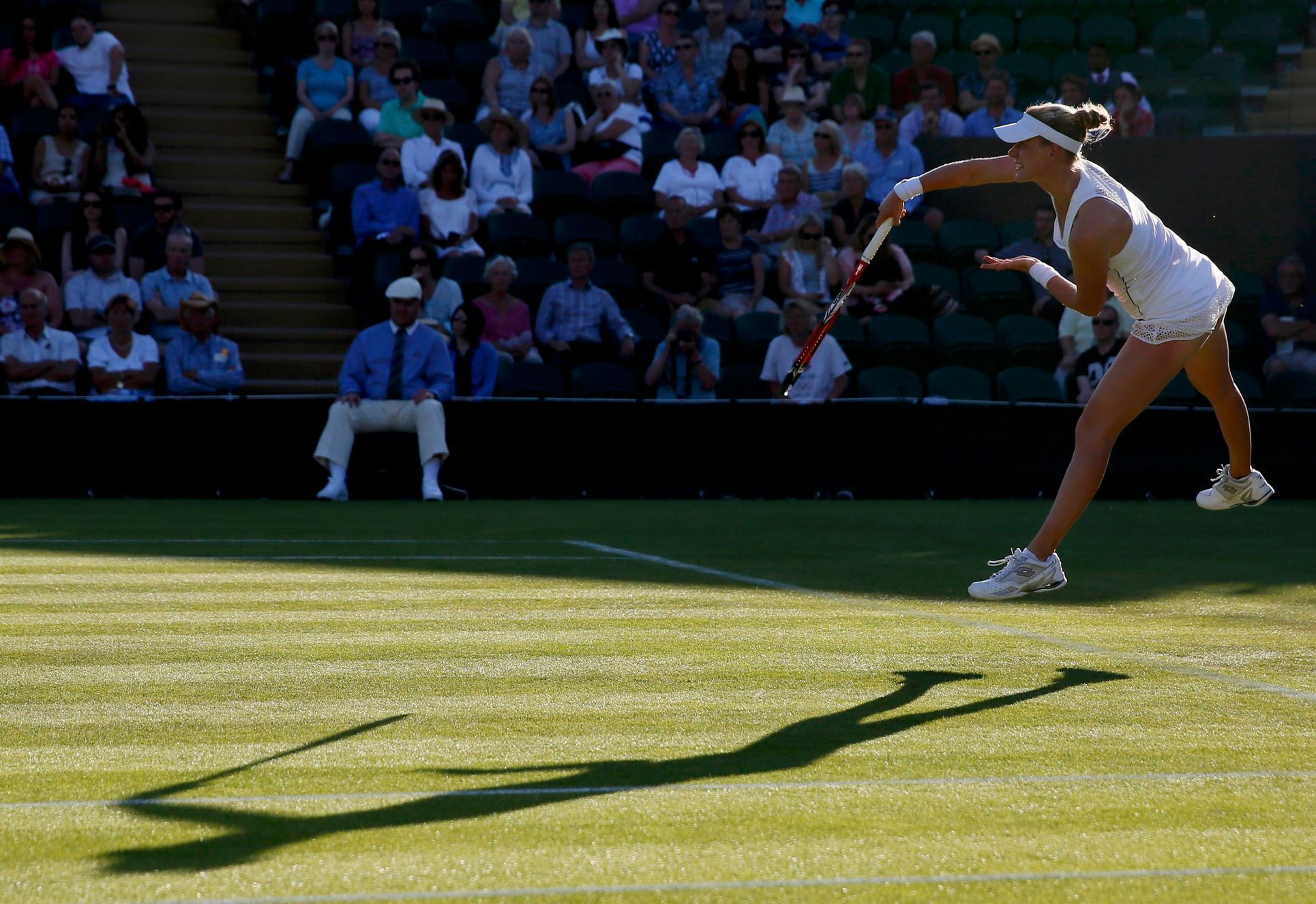 Alison Riske of the U.S.A. serves during her match against Lucie Safarova of the Czech Republic at the Wimbledon Tennis Championships in London