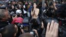 A topless protester is surrounded by cameramen during an anti-austerity demonstration outside the Spanish parliament in Madrid, September 25, 2012. Anti-austerity demonstrators protested in Madrid ahead of the government's tough 2013 budget that will cut into social services as the country teeters on the brink of a bailout. REUTERS/Paul Hanna (SPAIN - Tags: POLITICS CIVIL UNREST BUSINESS) Published: Zář. 25, 2012, 6:25 odp.