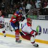 Hokejista Lva Praha Martin Škoula odehrává puk před Michailem Grabovským (vlevo) a Vladimirem Žarkovem v utkání KHL proti CSKA Moskva.