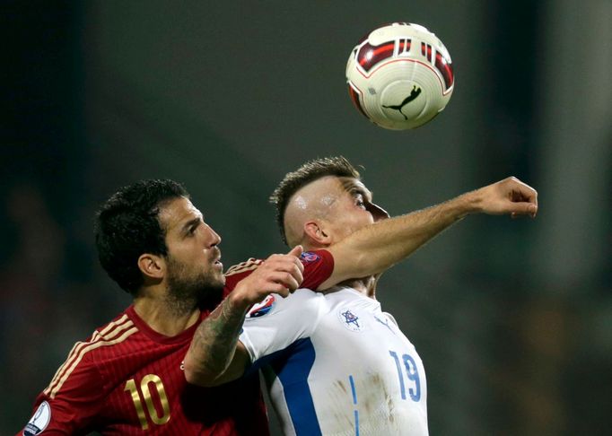 Fabregas of Spain challenges Kucka of Slovakia during their Euro 2016 qualification soccer match at the MSK stadium in Zilina