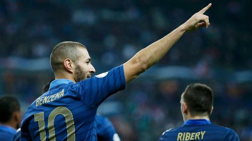France's Karim Benzema celebrates after scoring against Finland during the 2014 World Cup qualifying soccer match at the Stade de France stadium in Saint-Denis, near Pari