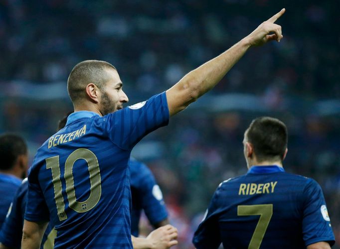 France's Karim Benzema celebrates after scoring against Finland during the 2014 World Cup qualifying soccer match at the Stade de France stadium in Saint-Denis, near Pari