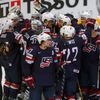Players of the U.S. celebrate after winning their Ice Hockey World Championship third-place game against the Czech Republic at the O2 arena in Prague