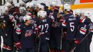 Players of the U.S. celebrate after winning their Ice Hockey World Championship third-place game against the Czech Republic at the O2 arena in Prague, Czech Republic May