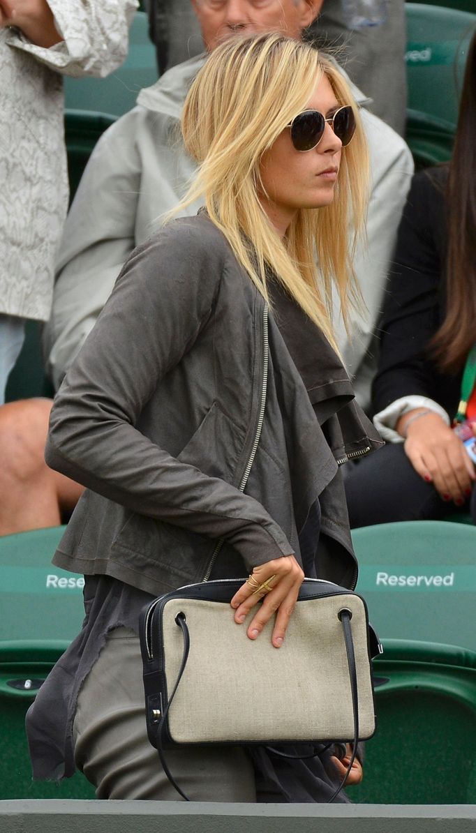 Maria Sharapova of Russia leaves court three during a rain break after watching the men's singles tennis match between Grigor Dimitrov of Bulgaria and Grega Zemlja of Slo