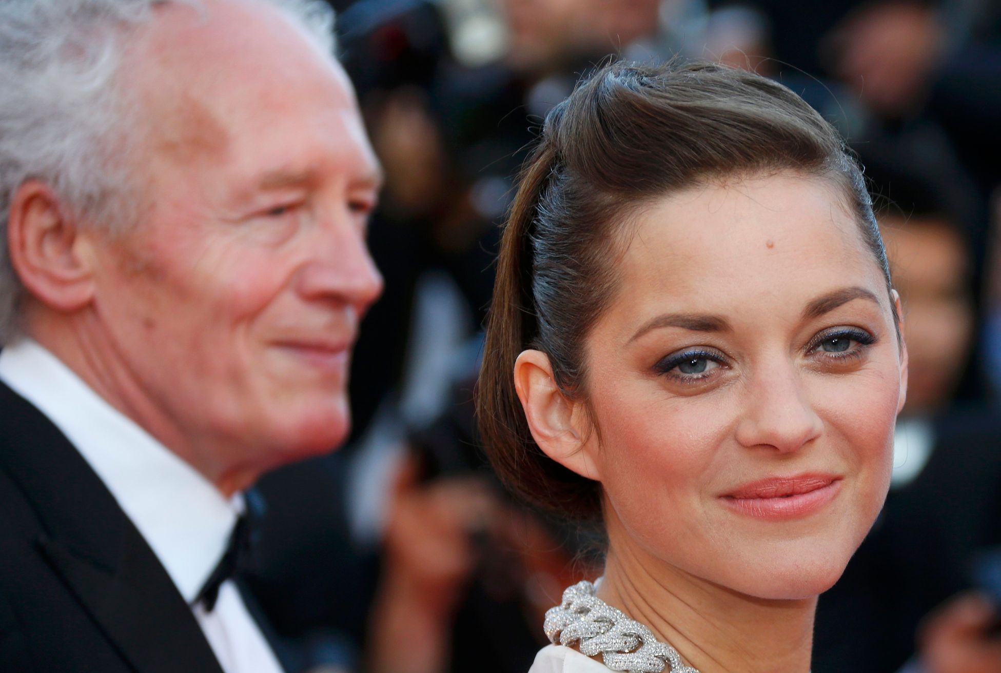 Director Jean-Pierre Dardenne and cast members Marion Cotillard pose on the red carpet as they arrivefor the screening of the film &quot;Deux jours, une nuit&quot; at the 67th Cannes Film Festival in