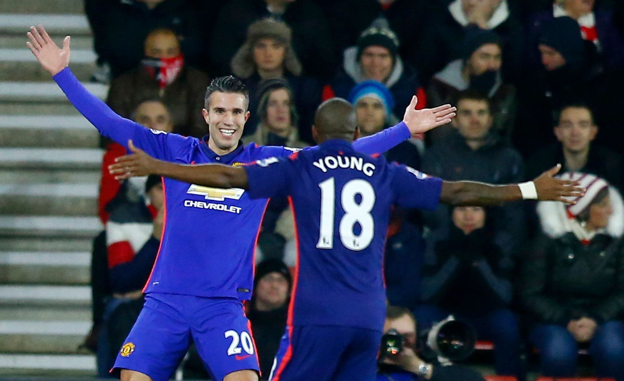 Manchester United's Robin van Persie celebrates with Ashley Young after scoring the opening goal during their English Premier League soccer match against Southampton at St Mary's Stadium in Southampto