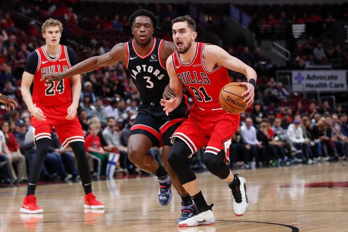 Dec 9, 2019; Chicago, IL, USA; Chicago Bulls guard Tomáš Satoranský (31) drives to the basket against the Toronto Raptors forward OG Anunoby (3) during the first half at