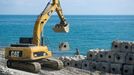 Olympic Park under construction in Sochi, Russia SOCHI, RUSSIA. MAY 20, 2013. An excavator placing shore defences on the seafront of Olympic Park. In 2014 Sochi is set to host 2014 Winter Olympic Games.