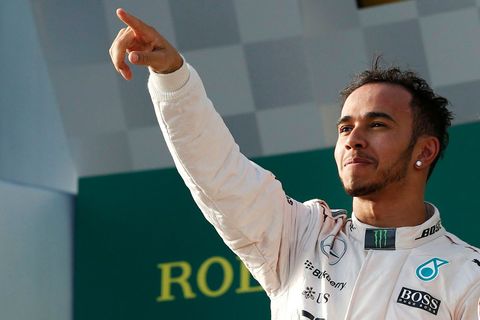 Mercedes Formula One driver Lewis Hamilton of Britain celebrates his victory on the podium after the Australian F1 Grand Prix at the Albert Park circuit in Melbourne