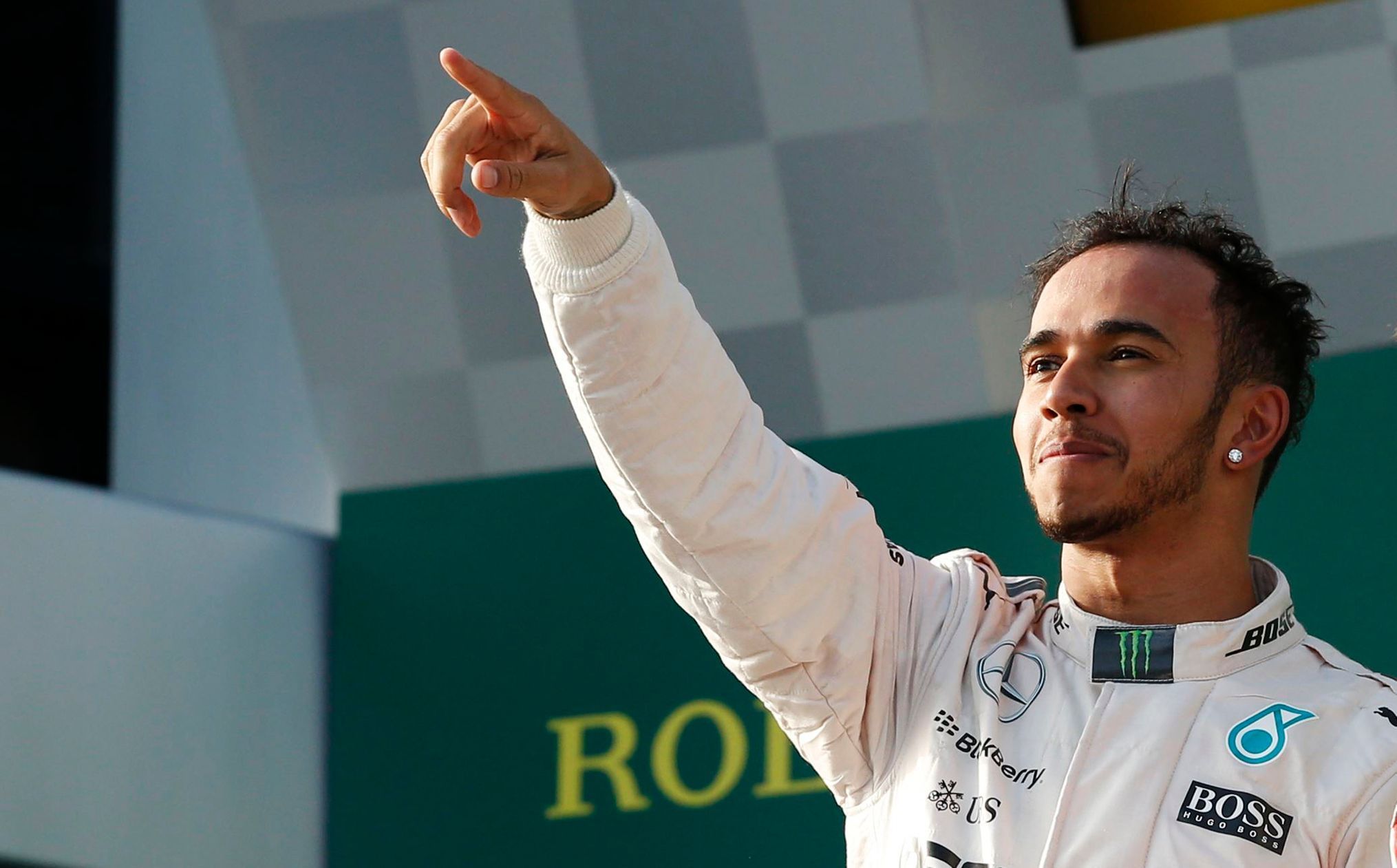 Mercedes Formula One driver Lewis Hamilton of Britain celebrates his victory on the podium after the Australian F1 Grand Prix at the Albert Park circuit in Melbourne