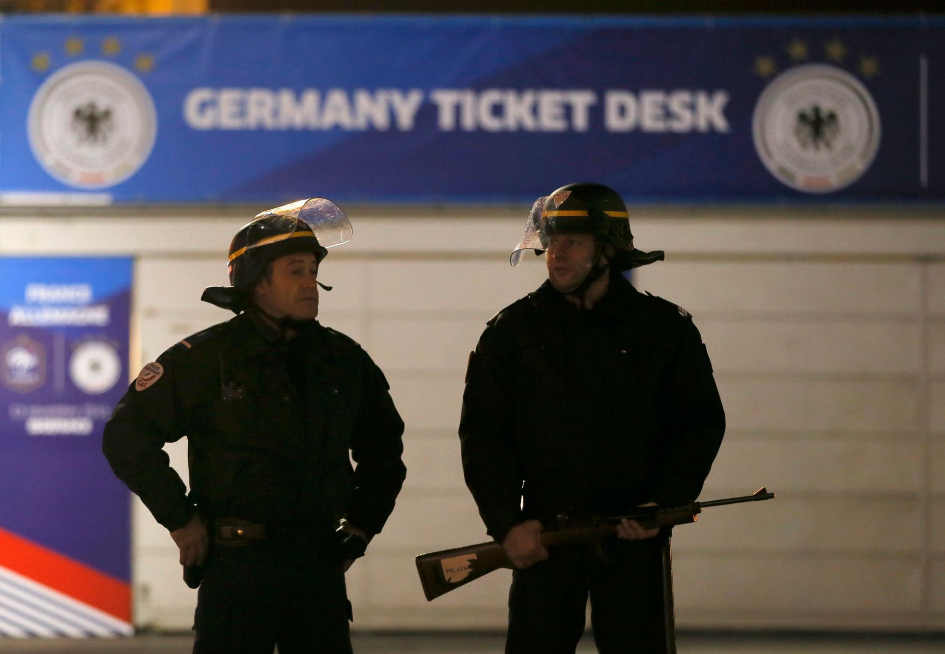 Police stand outside the Stade de France soccer stadium where explosions were reported during the France vs German friendly match