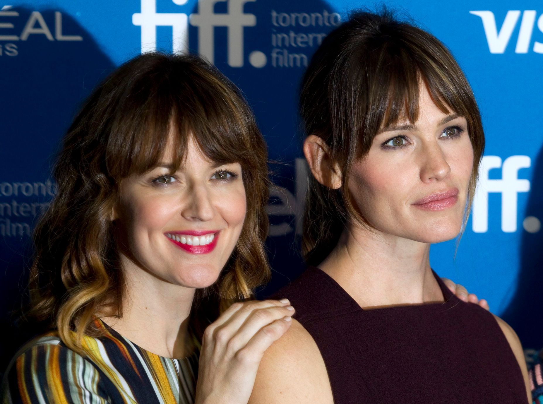 Actresses DeWitt and Garner attend a news conference to promote their film &quot;Men, Women &amp; Children&quot; at the Toronto International Film Festival in Toronto