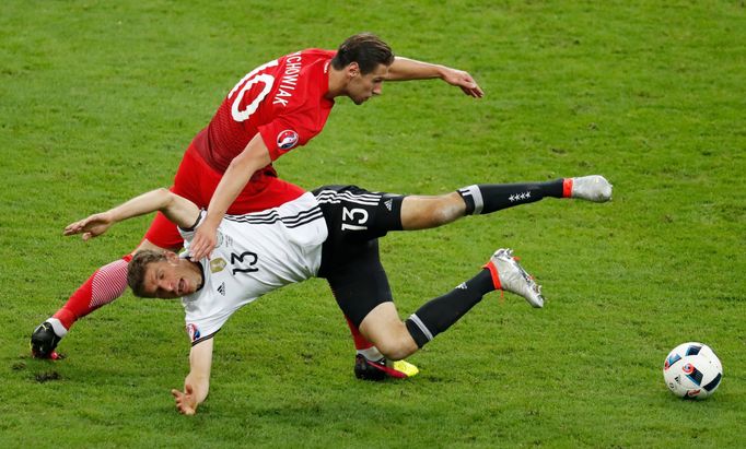 Germany's Thomas Muller in action with Poland's Grzegorz Krychowiak