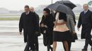 U.S. President Barack Obama (C) and former U.S. President George Bush (R) are greeted by officials on their arrival at Air Force Base Waterkloof, Pretoria in this handout picture provided by the South African Government Communication and Information System (GCIS) on December 10, 2013.