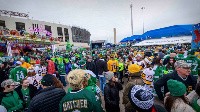 Jan 1, 2020; Dallas, Texas, USA; A view of the Dallas Stars fans and Nashville Predators fans and the fair park midway and the rides before the 2020 Winter Classic hockey