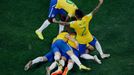 Brazil's players celebrate a goal by teammate Oscar (bottom, obscured) against Croatia during their 2014 World Cup opening match at the Corinthians arena in Sao Paulo Jun