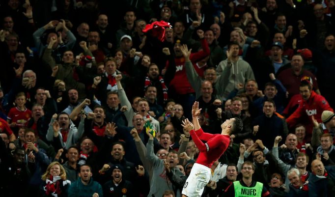 Manchester United's Robin van Persie celebrates after scoring during their English Premier League soccer match against Chelsea at Old Trafford in Manchester