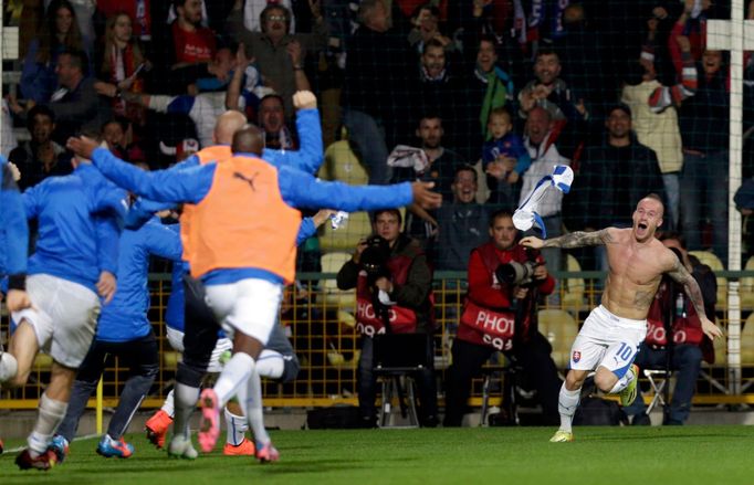 Stoch of Slovakia celebrates his goal against Spain with team mates during their Euro 2016 qualification soccer match at the MSK stadium in Zilina