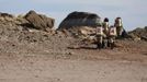 Members of Crew 125 EuroMoonMars B mission venture out in their simulated spacesuits to collect geologic samples for study at the Mars Desert Research Station (MDRS) in the Utah desert March 2, 2013. The MDRS aims to investigate the feasibility of a human exploration of Mars and uses the Utah desert's Mars-like terrain to simulate working conditions on the red planet. Scientists, students and enthusiasts work together developing field tactics and studying the terrain. All outdoor exploration is done wearing simulated spacesuits and carrying air supply packs and crews live together in a small communication base with limited amounts of electricity, food, oxygen and water. Everything needed to survive must be produced, fixed and replaced on site. Picture taken March 2, 2013. REUTERS/Jim Urquhart (UNITED STATES - Tags: SCIENCE TECHNOLOGY SOCIETY ENVIRONMENT) ATTENTION EDITORS: PICTURE 16 OF 31 FOR PACKAGE 'MARS IN THE DESERT' SEARCH 'JIM MARS' FOR ALL IMAGES Published: Bře. 11, 2013, 2:05 odp.