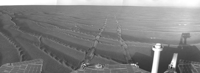 View from Southwest of Victoria Crater This mosaic of frames from the navigation camera on NASA's Mars Exploration Rover Opportunity gives a view to the northeast from the rover's position on its 1,687th Martian day, or sol (Oct. 22, 2008). By that date, Opportunity had driven southwestward from Victoria Crater, beginning a long trek toward a larger crater, Endeavour. Image credit: NASA/JPL-Caltech