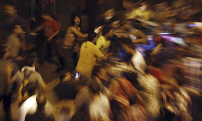 Anti-Mursi protesters clash with members of the Muslim Brotherhood and supporters of ousted Egyptian President Mohamed Mursi, at Ramsis square, which leads to Tahrir Square, during a celebration marking Egypt's 1973 war with Israel, in Cairo October 6, 2013. At least 33 people were killed during protests in Egypt on Sunday, the interior ministry said, as the crisis since the army seized power three months ago showed no sign of abating.