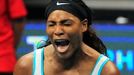 Serena Williams of the Singapore Slammers reacts after returning a shot to Kirsten Flipkens of the Manila Mavericks during their women's single match at the International