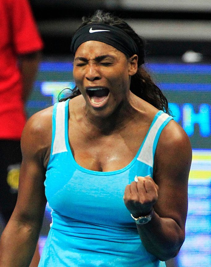 Serena Williams of the Singapore Slammers reacts after returning a shot to Kirsten Flipkens of the Manila Mavericks during their women's single match at the International