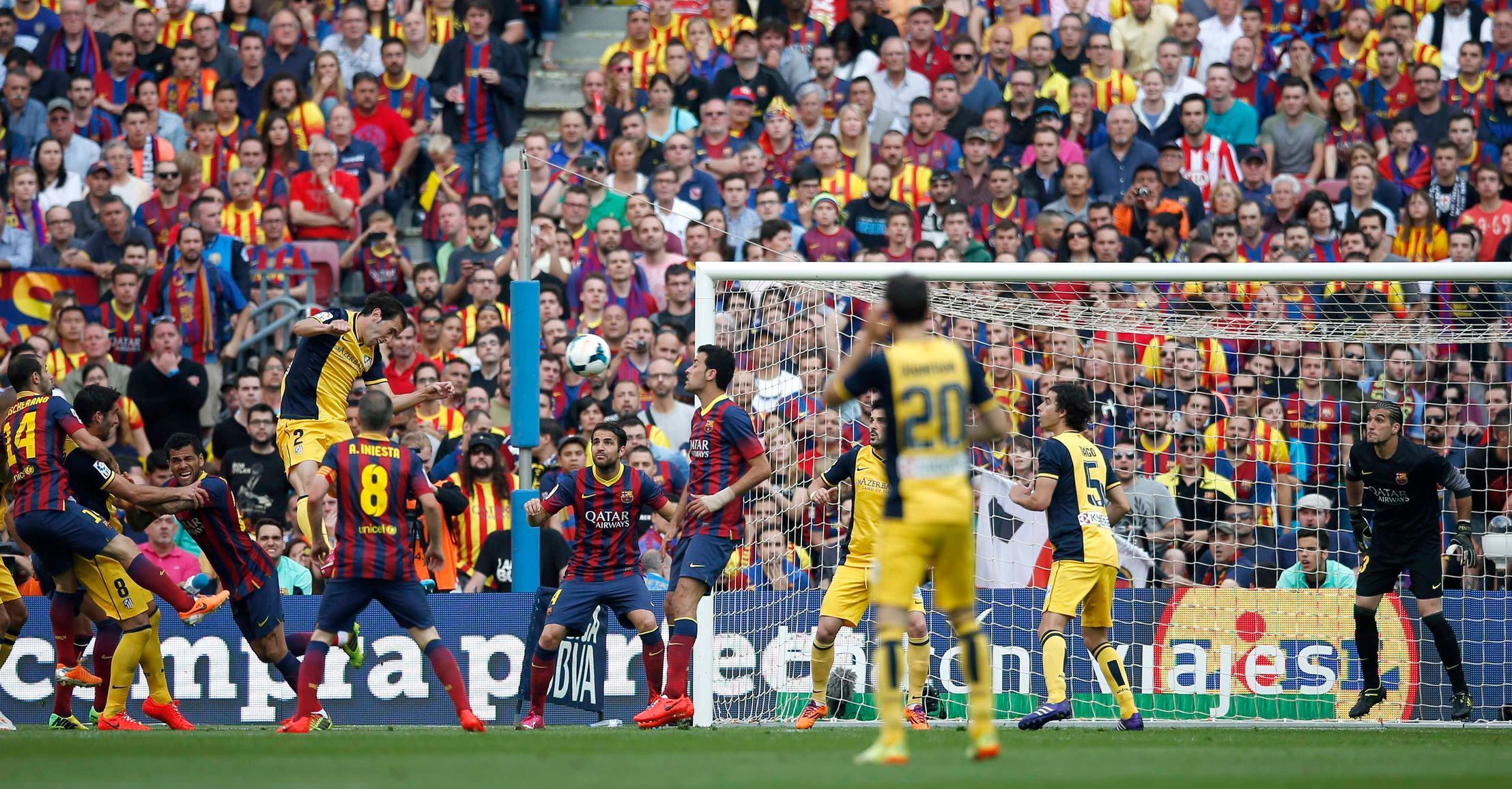 Atletico Madrid's Godin heads the ball to score against Barcelona during their Spanish first division soccer match in Barcelona