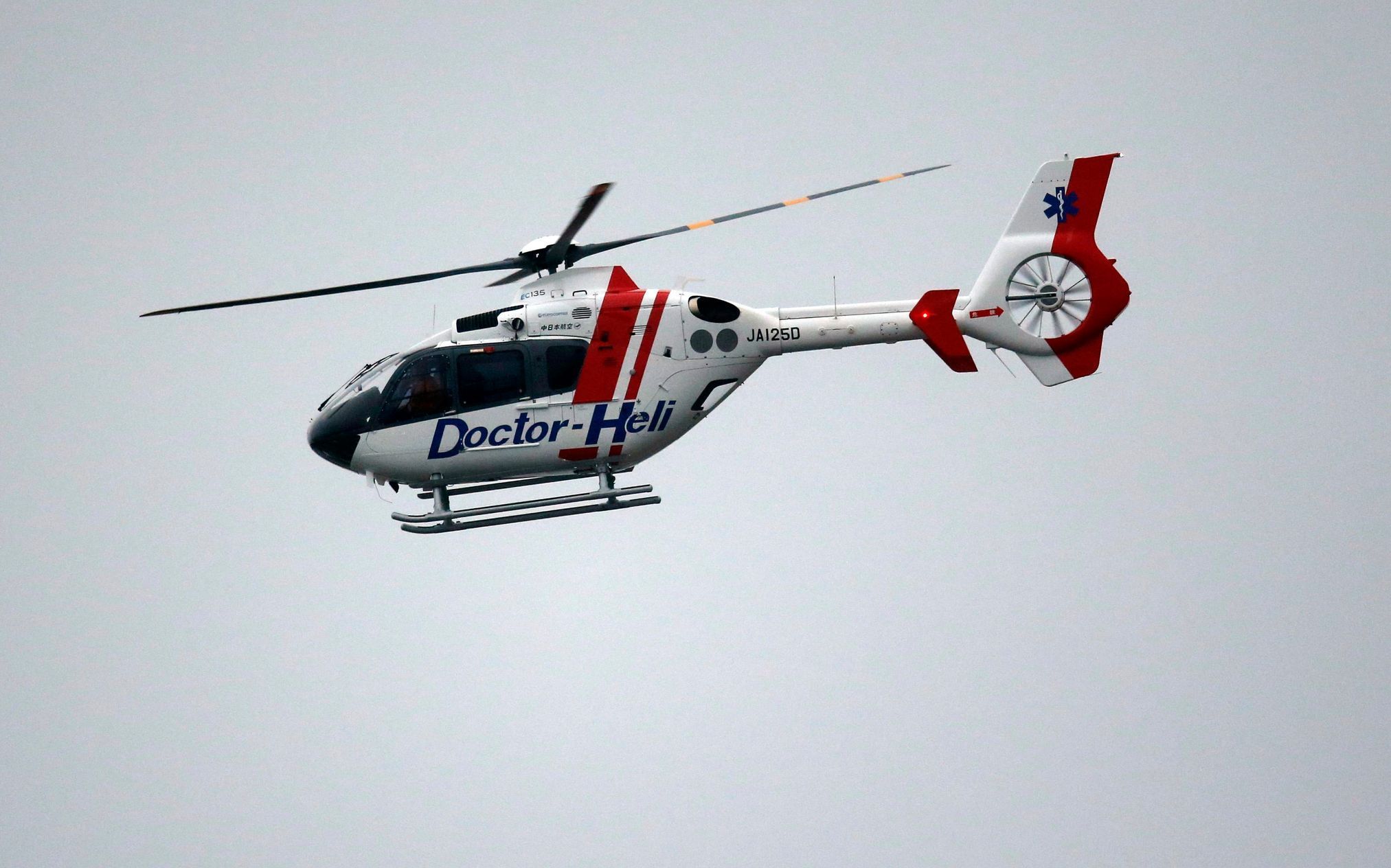 A medical evacuation helicopter takes to the air after the race was stopped following a crash by Marussia Formula One driver Jules Bianchi of France at the Japanese F1 Grand Prix at the Suzuka Circuit