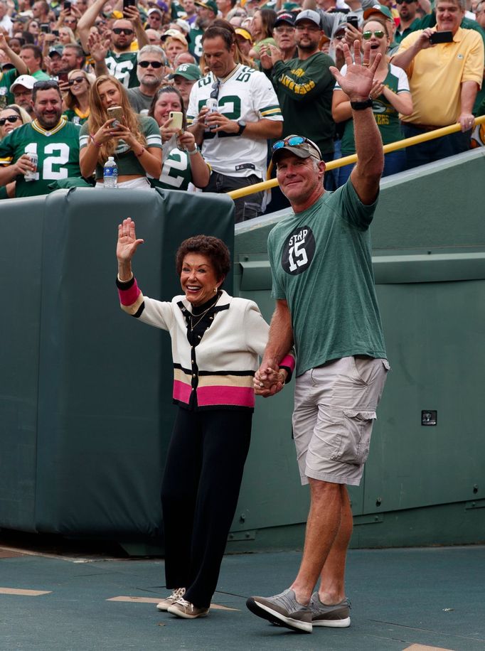 Sep 15, 2019; Green Bay, WI, USA; Former Green Bay Packers quarterback Brett Favre escorts Cherry Starr onto the field prior to the game against the Minnesota Vikings at