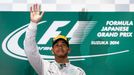 Mercedes Formula One driver Lewis Hamilton of Britain waves to fans after winning the Japanese F1 Grand Prix at the Suzuka Circuit October 5, 2014. REUTERS/Toru Hanai (JA