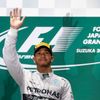 Mercedes Formula One driver Hamilton of Britain waves to fans after winning the Japanese F1 Grand Prix at the Suzuka Circuit