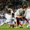Barcelona's Messi and Real Madrid's Alonso and Modric challenge for ball during La Liga's second 'Clasico' soccer match of the season in Madrid