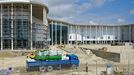 Olympic Park under construction in Sochi, Russia SOCHI, RUSSIA. MAY 20, 2013. The construction site of a hotel for journalists, Adler Arena Stadium, and Bolshoi Stadium (L-R in the distance) in Olympic Park. In 2014 Sochi is set to host 2014 Winter Olympic Games.