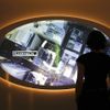 A visitor looks at a video screen at the 'Top Secret' Spy Museum in Oberhausen, July 10, 2013. The museum presents various objects, devices and gadgets used for spying or related to espionage. REUTERS/Ina Fassbender (GERMANY - Tags: SOCIETY ENTERTAINMENT) Published: Čec. 10, 2013, 3:10 odp.