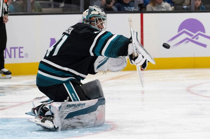 Nov 7, 2024; San Jose, California, USA;  San Jose Sharks goaltender Vitek Vanecek (41) deflects the puck during the first period against the Minnesota Wild at SAP Center