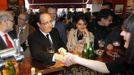 Hollande, Socialist Party candidate for the 2012 French presidential election, is seen in a cafe in Clermont-Ferrand