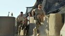 Britain's Prince Harry (L) races out from the VHR (very high ready-ness) tent with fellow crew members, to scramble his Apache helicopter at Camp Bastion, southern Afghanistan in this photograph taken November 3, 2012, and released January 21, 2013. The Prince, who is serving as a pilot/gunner with 662 Squadron Army Air Corps, is on a posting to Afghanistan that runs from September 2012 to January 2013. Photograph taken November 3, 2012. REUTERS/John Stillwell/Pool (AFGHANISTAN - Tags: MILITARY POLITICS SOCIETY ROYALS CONFLICT) Published: Led. 21, 2013, 9:42 odp.