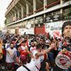 People gather to mourn the death of soccer legend Diego Maradona, outside the Diego Armando Maradona stadium, in Buenos Aires