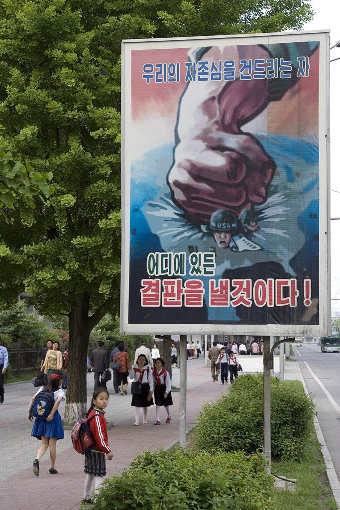 North Korea propaganda epa01030328 (FILE) A file picture dated 01 June 2006 shows a poster urging armed resistance to the US military threat gets scant regard on a pavement in central Pyongyang, North Korea. North Korea remains the leading exponent of the Socialist Realist school of artistic expression which dates back to the early revolutionary Soviet Union. Strident slogans, square jawed worker heroes and triumphal praise of the leadership add colour to the otherwise drab and concrete filled expanses of North Korea. EPA/ADRIAN BRADSHAW
