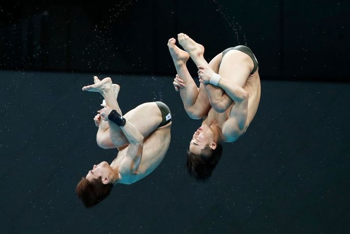 Diving - FINA Diving World Cup 2021 and Tokyo 2020 Olympics Aquatics Test Event - Tokyo Aquatics Centre, Tokyo, Japan - May 1, 2021 South Korea's Yeongnam Kim and Haram W