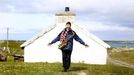 Artist and poet Barry Edgar Pilcher, 69, poses outside a cottage on the Island of Inishfree in County Donegal, May 1, 2012. REUTERS/Cathal McNaughton