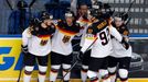 Germany's Thomas Oppenheimer (obscured) celebrates his goal against Switzerland with team mates during their men's ice hockey World Championship Group B game at Minsk Are