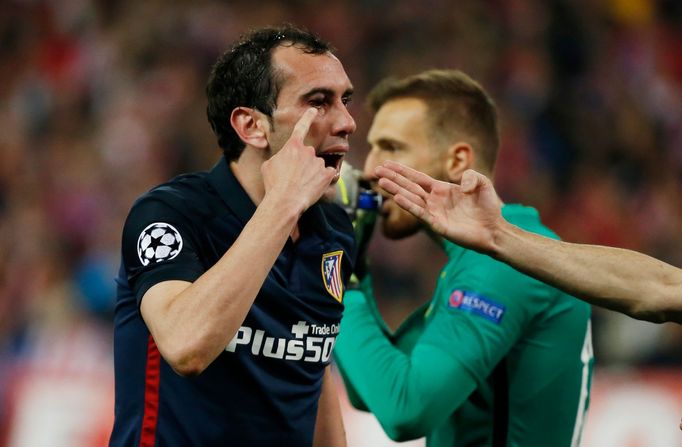 Atletico's Diego Godin appeals to the referee Nicola Rizzoli